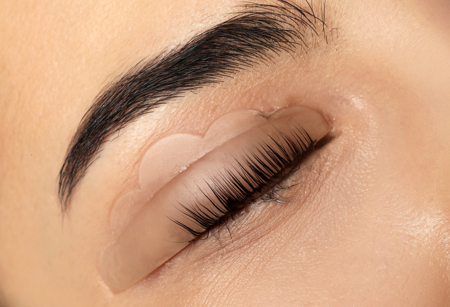 Young Woman Undergoing Eyelash Lamination, Closeup. Professional Service